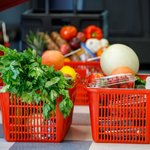 Baskets of fresh produce in red baskets