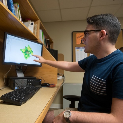 Student Gesturing toward Model on Screen