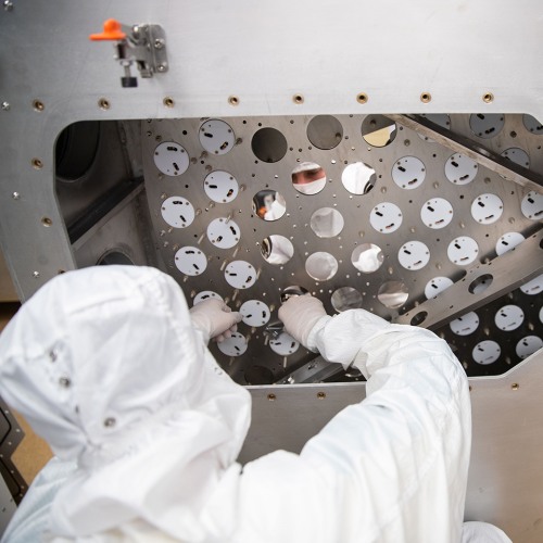 Researcher studying dark matter in lab