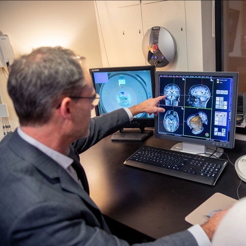 Examining scans from an MRI.